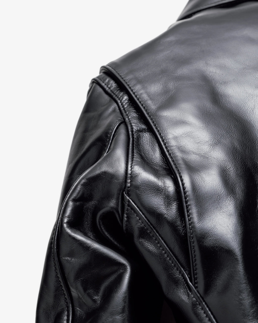 Detail shot of shoulder gusset on black horsehide leather jacket. See product details for more information.
