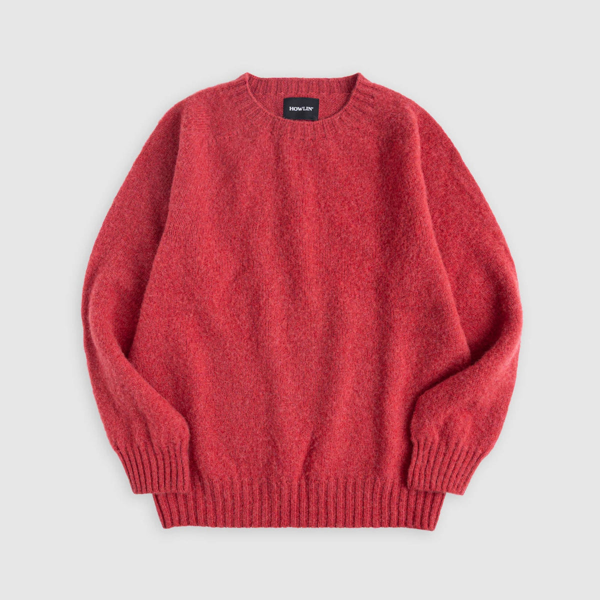 Flat lay of Birth of the Cool in Velvet Kiss (red). Howlin label visible. See product description for more details.