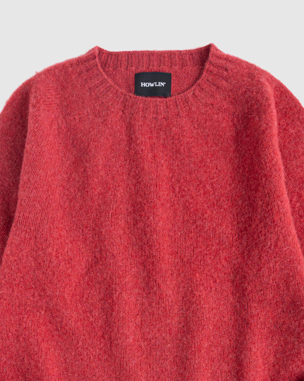 Flat lay of Birth of the Cool in Velvet Kiss (red). Zoomed view of collar. Howlin label visible. See product description for more details.