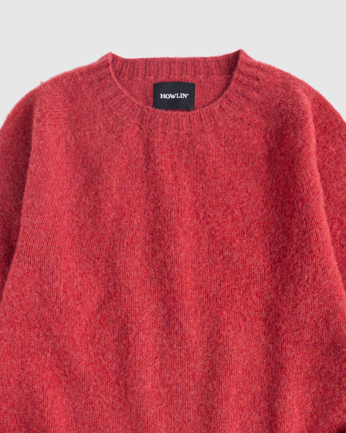 Flat lay of Birth of the Cool in Velvet Kiss (red). Zoomed view of collar. Howlin label visible. See product description for more details.