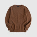 Flat lay of brown shetland wool sweater. Howlin' label visible. See product description for more details.
